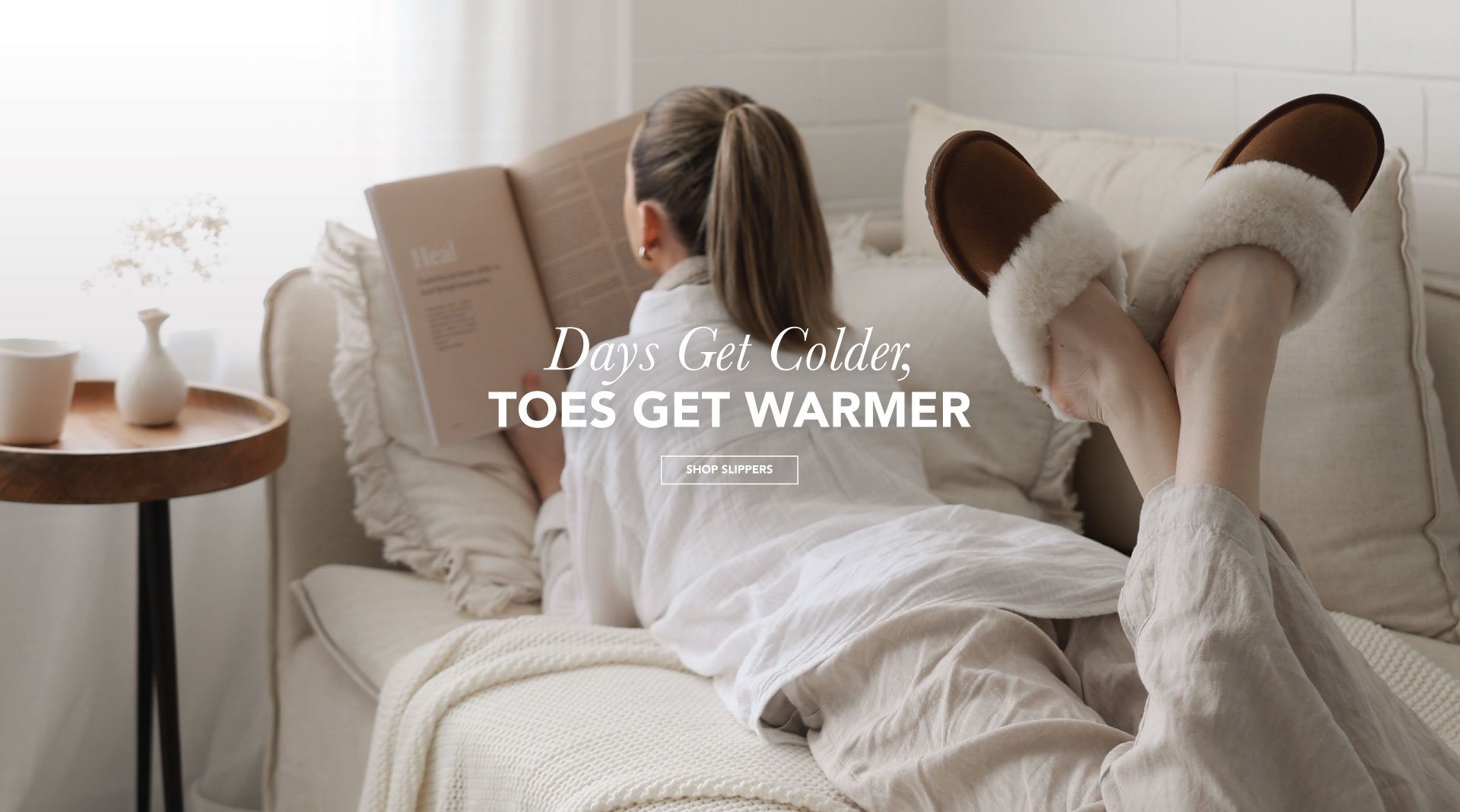 ADD ALT TEXT reads:Days get colder, toes get warmer. Shop Slippers.