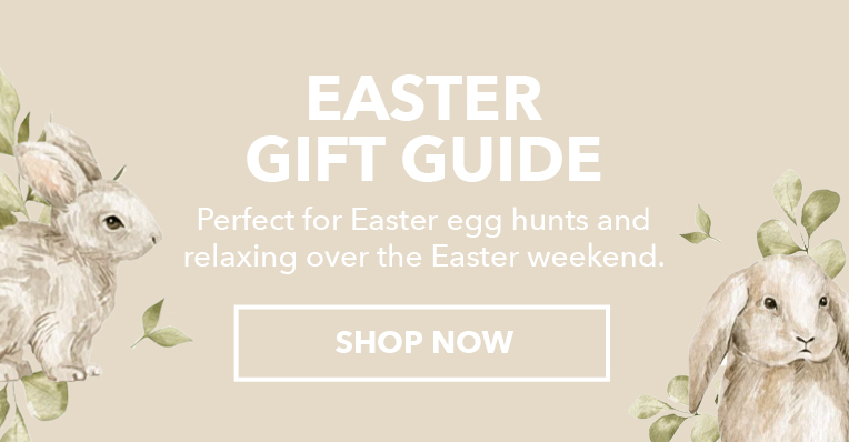 Three children sitting on couch wearing matching EMU Austraia sheepskin boots. Heading reads: Easter Gift Guide,
                Secondary text reads: Perfect for Easter egg hunts and relaxing over the Easter weekend.
                Call to Action: Shop Now
