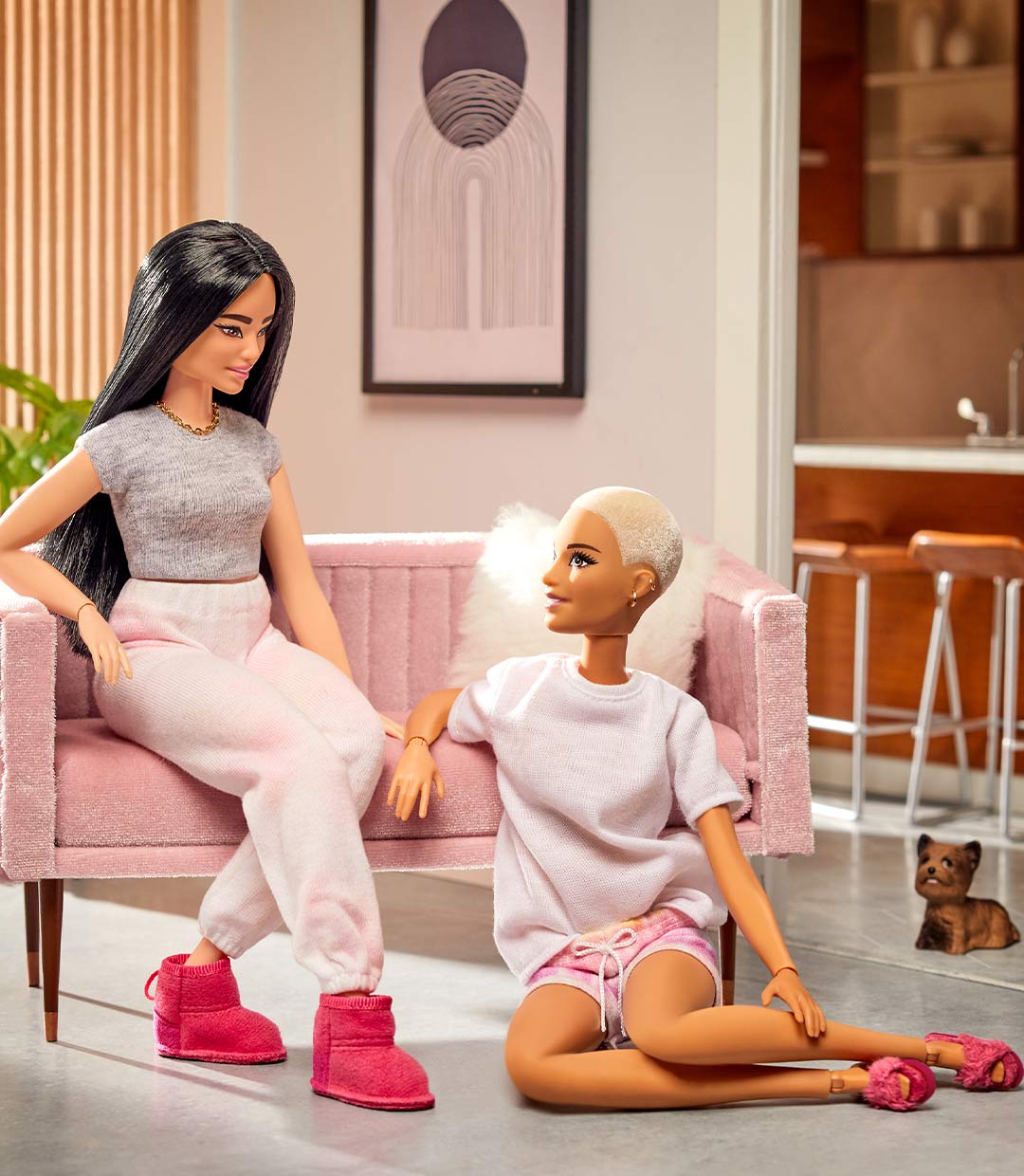 Barbie figurines wearing mini versions of exclusive EMUxBarbie collaboration boots and slippers