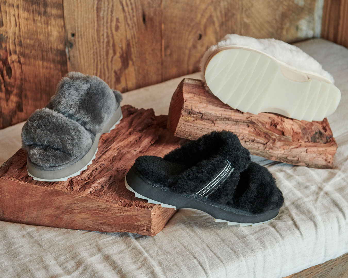 Flatlay of Wobbegong sheepskin slippers in charcoal, black and natural colourways