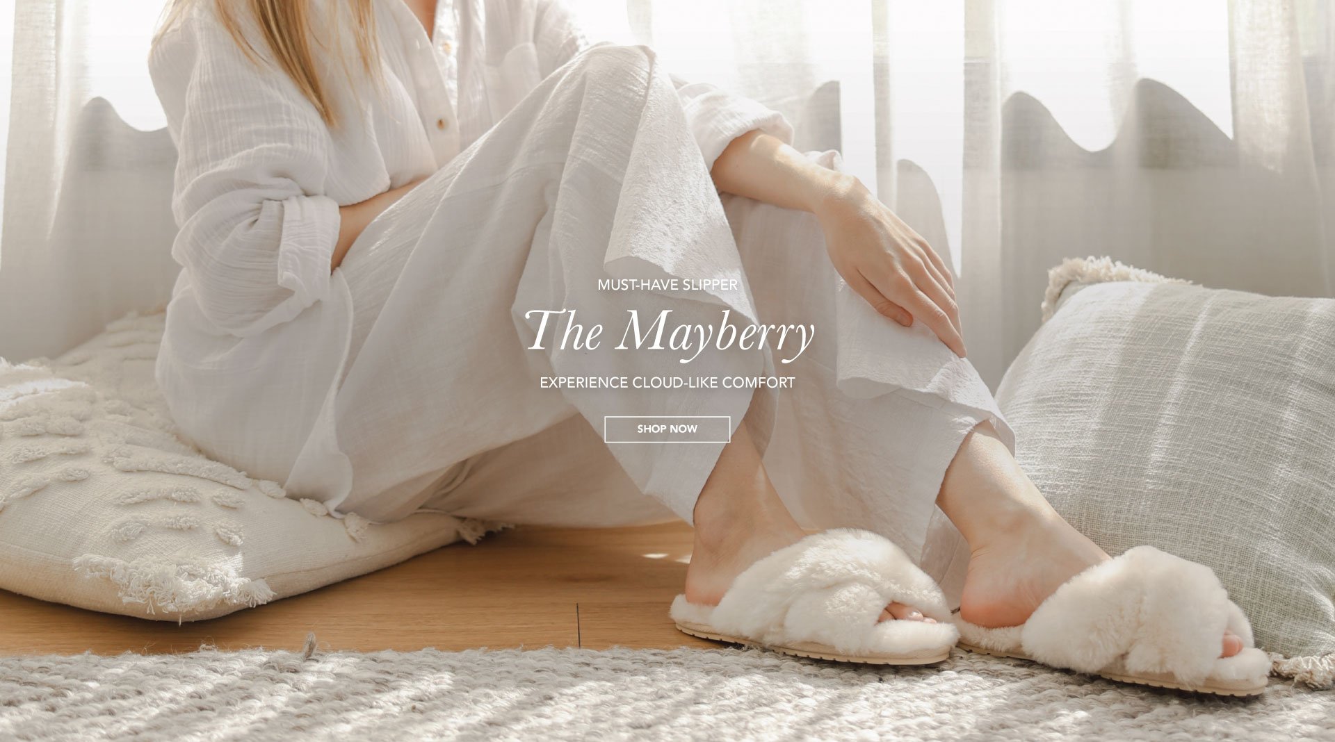 ADD ALT TEXT reads:Must-Have Slipper. The Mayberry. Experience cloud-like comfort. Shop Now.