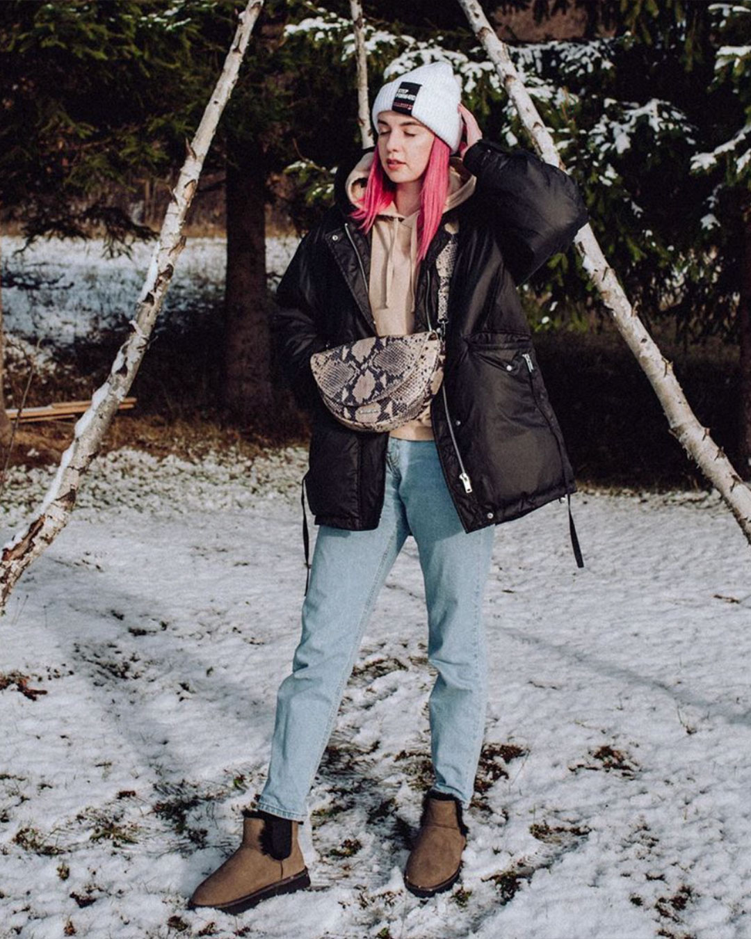 Woman standing outside in snow wearing Thresher sheepskin boots